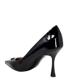 Black patent pump with pointed toe and slim stiletto heel; gold-tone lock hardware
