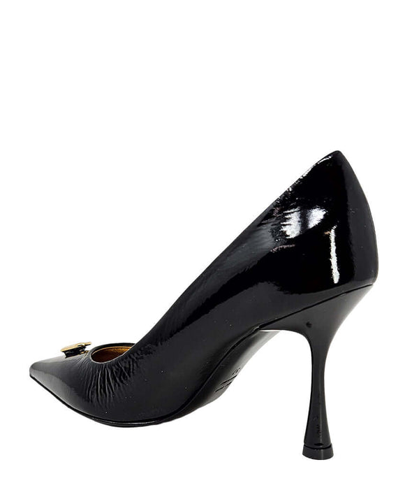 Black patent pump with pointed toe and slim stiletto heel; gold-tone lock hardware