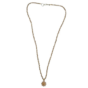 Brown beaded charm necklace with faceted strand, silver clasp, small flower charm