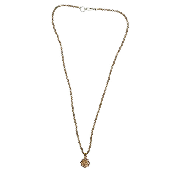 Brown beaded charm necklace with faceted strand, silver clasp, small flower charm