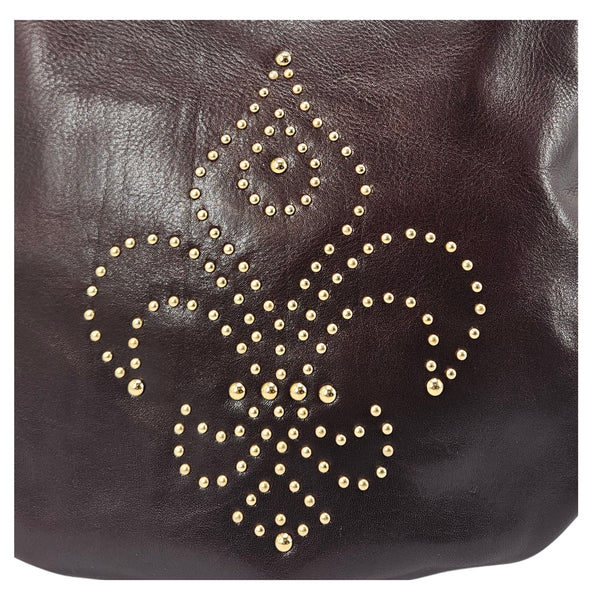 Brown leather shoulder bag front with gold fleur de lis studded pattern