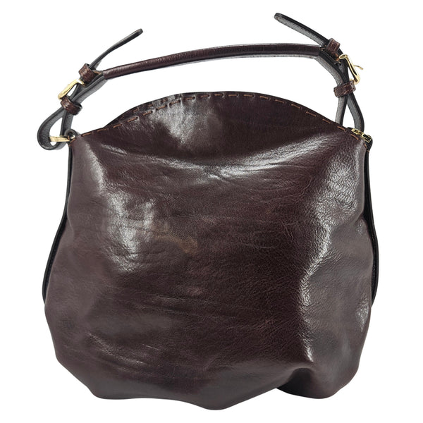 Brown leather shoulder bag with curved top handles and adjustable shoulder strap