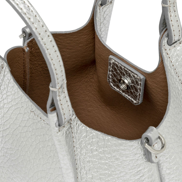 Silver mini hobo bag interior view showing metal turn-lock and brown lining