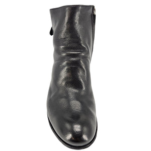 Black leather ankle boot back profile with low stacked block heel