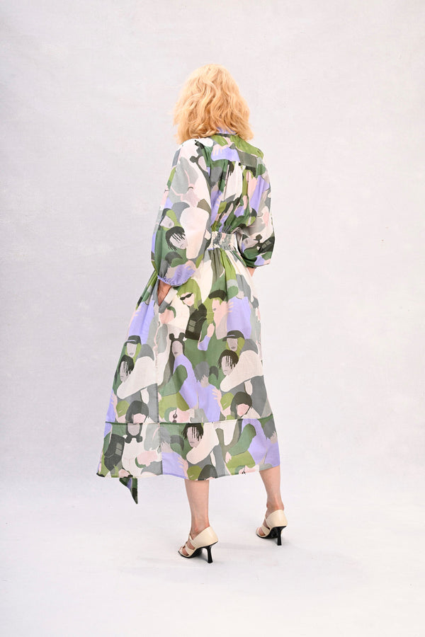 Green and lavender abstract face print midi dress with belt, long sleeves, back view