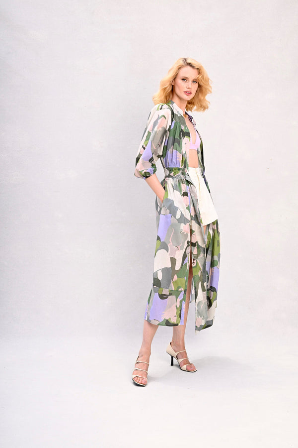 Long shirt dress with tied waist, green and lavender face print, long sleeves