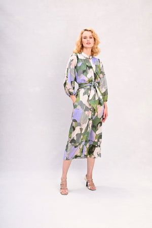 Green and lavender abstract face print midi dress with belt, long sleeves, standing front
