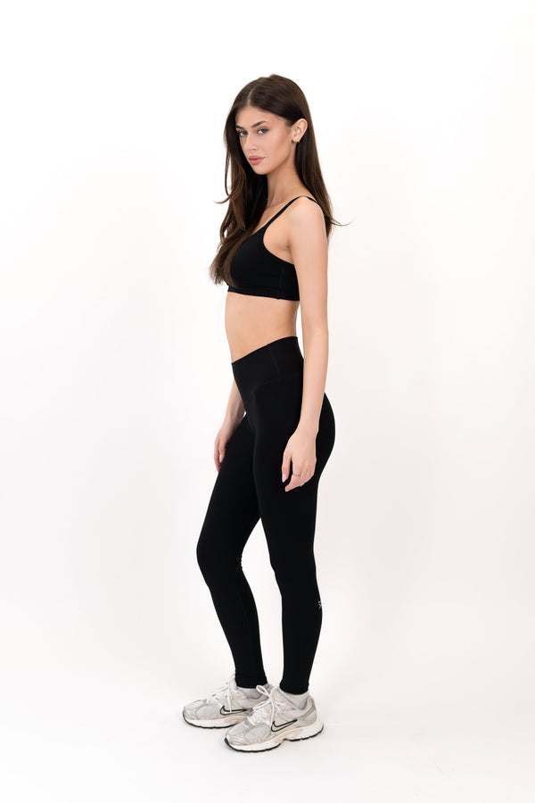 Black high-rise leggings, side view, slim fit full length.