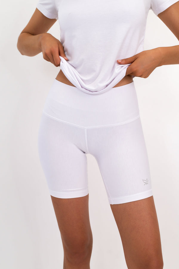White 5-inch core shorts with smooth front panels and stitched pocket seams