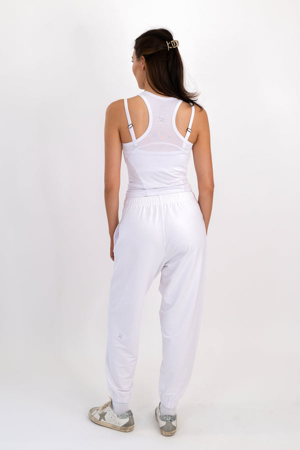 White sweatpants with elastic waistband and relaxed tapered fit