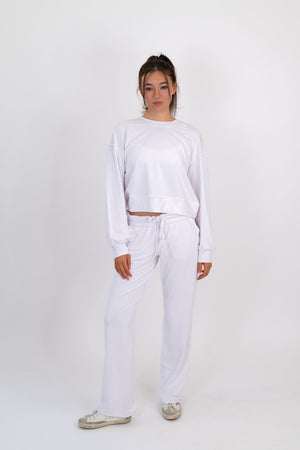 White wide-leg sweatpants with drawstring waist and relaxed straight legs