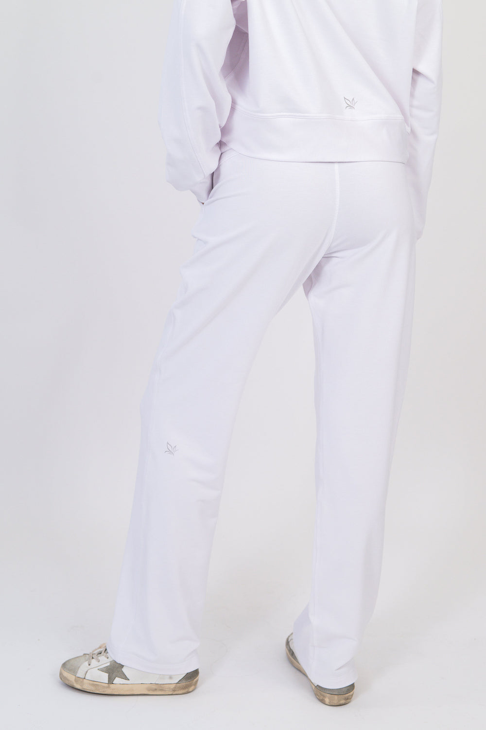 White wide-leg sweatpants with drawstring waist and relaxed straight legs