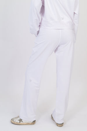White wide-leg sweatpants with drawstring waist and ankle-length relaxed fit
