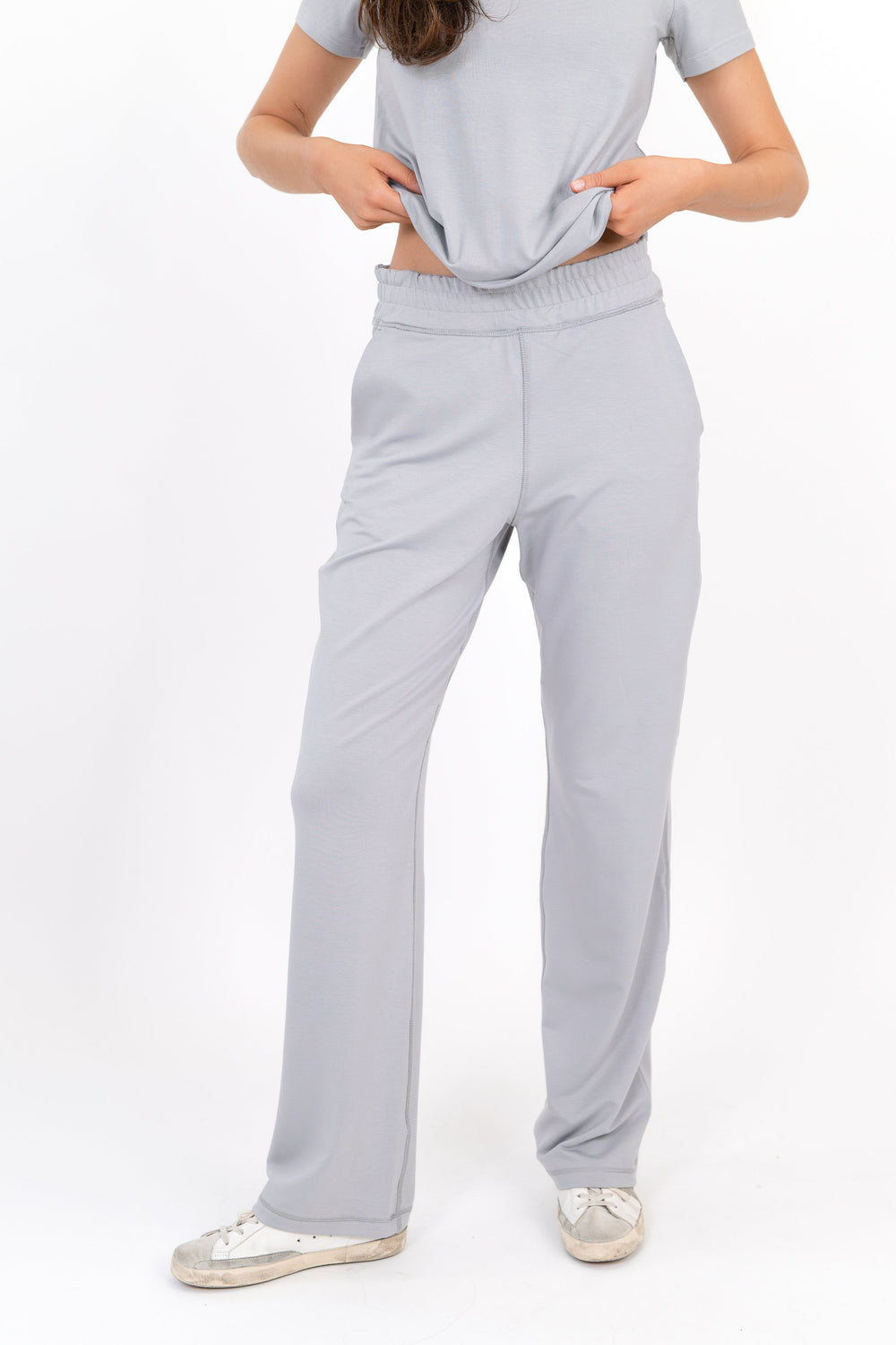 Gray wide-leg sweatpants with elastic waistband and side pockets
