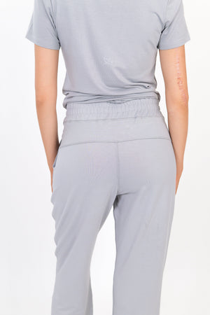 Light gray wide-leg sweatpants with gathered elastic waistband
