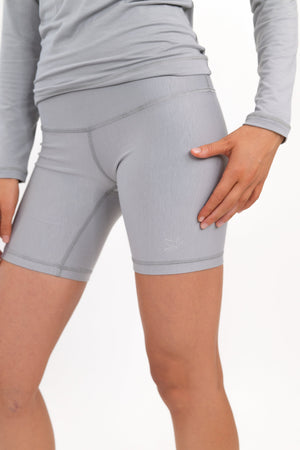 Light gray 5-inch core shorts, close-up of fitted thigh and waistband seam.