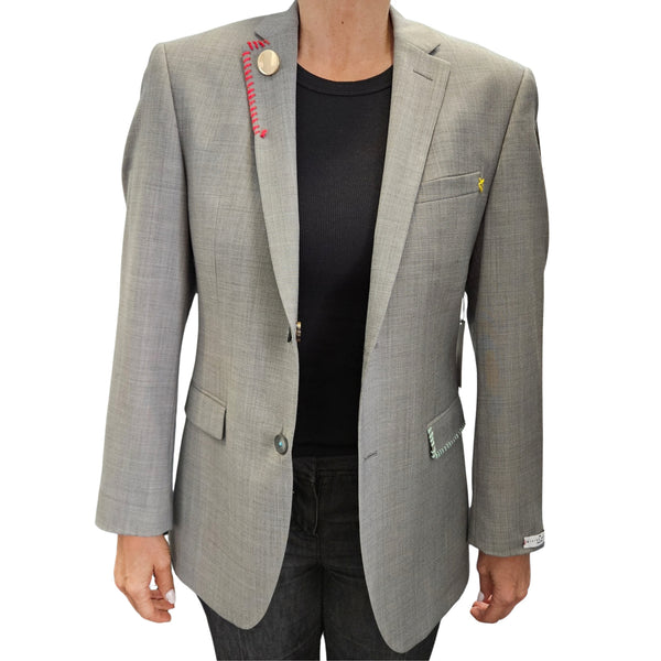 Grey single-breasted blazer with notch lapels and colorful pocket accents