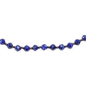 Blue faceted lapis bead necklace detail of round faceted beads with gold-tone spacers