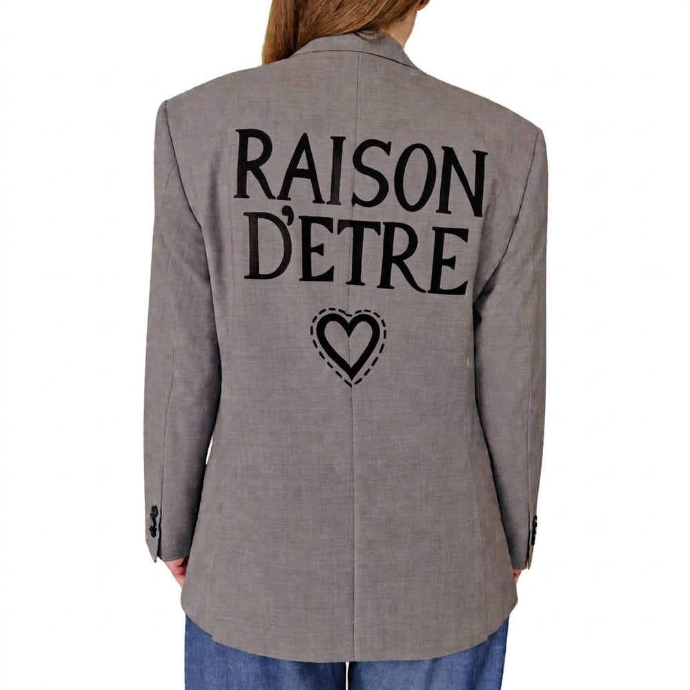 Grey blazer back with large "RAISON D'ETRE" text and heart outline graphic