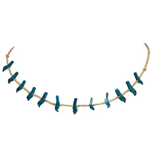 Gold-tone bead necklace with evenly spaced teal bird charms