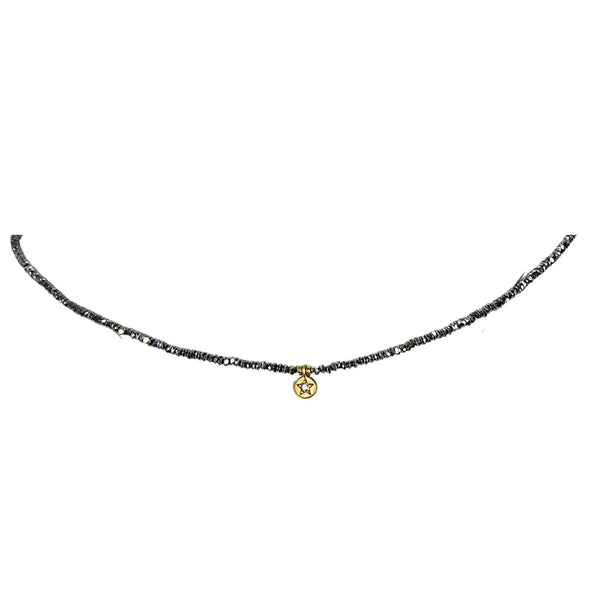 Grey beaded necklace with small gold star coin charm centerpiece