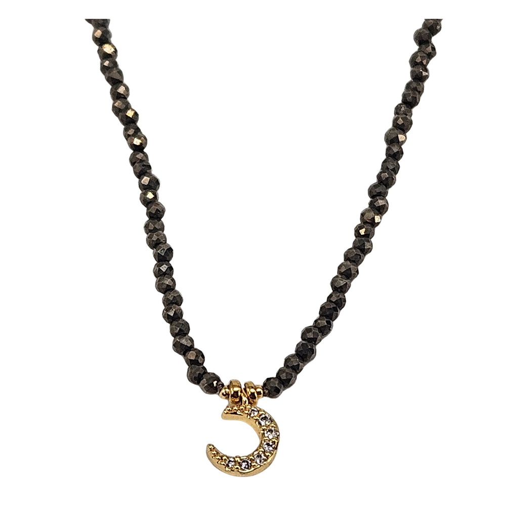 Black hematite micro-bead choker with gold moon pendant and crystal detail