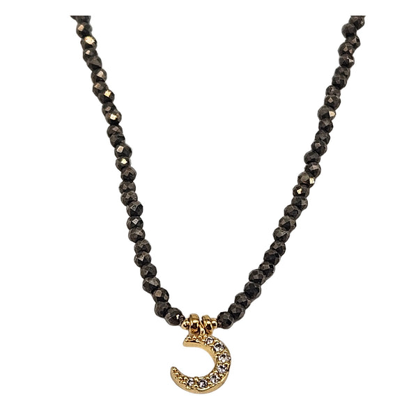 Black hematite micro-bead choker with gold moon pendant and crystal detail