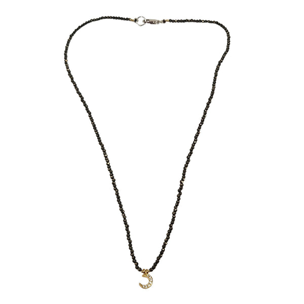 Black micro-bead choker with small gold moon charm and adjustable back chain