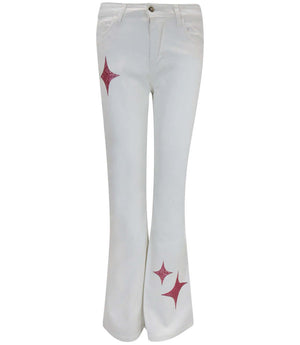 Light wash denim jeans with rose star glitter accents at the hem
