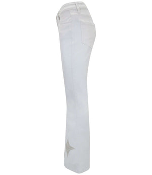 Light wash denim jeans with a gold glitter star detail on the leg