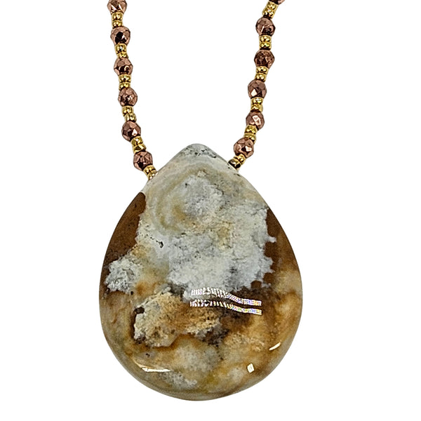 Gold-tone beaded chain necklace with teardrop jasper pendant and crystal-like center