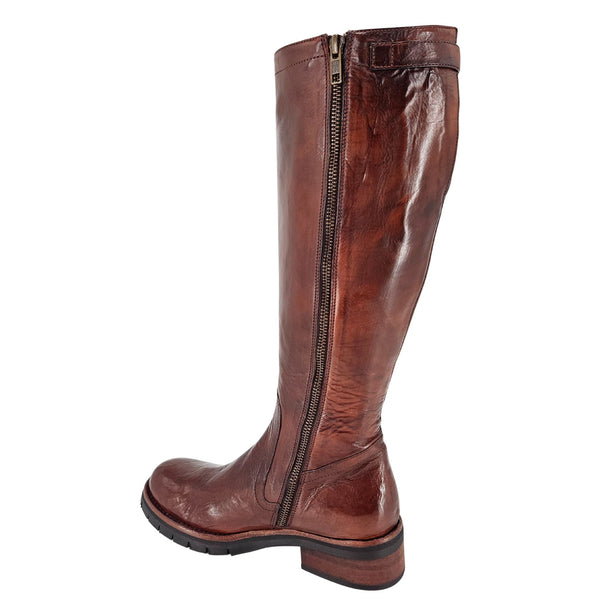 Brown leather tall flat boot with full-length side zipper and tread sole.