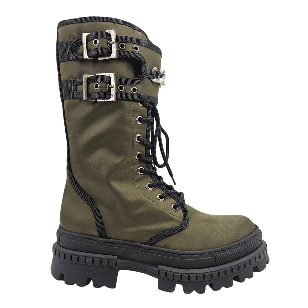 Khaki combat boot with chain-buckle straps, harness detail, and black lace-up shaft.