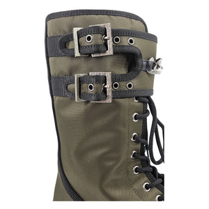 Khaki combat boot close-up with black buckled straps, silver chain charm, and lace eyelets.