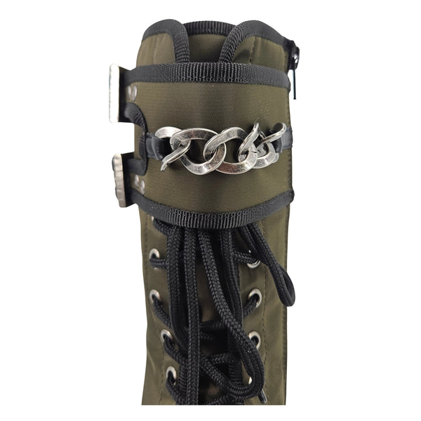 Khaki combat boot side view with silver chain ankle strap and black lace-up laces.