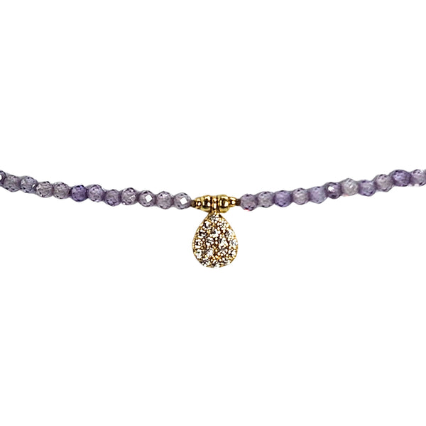 Lavender faceted bead necklace with gold-tone teardrop charm pendant detail