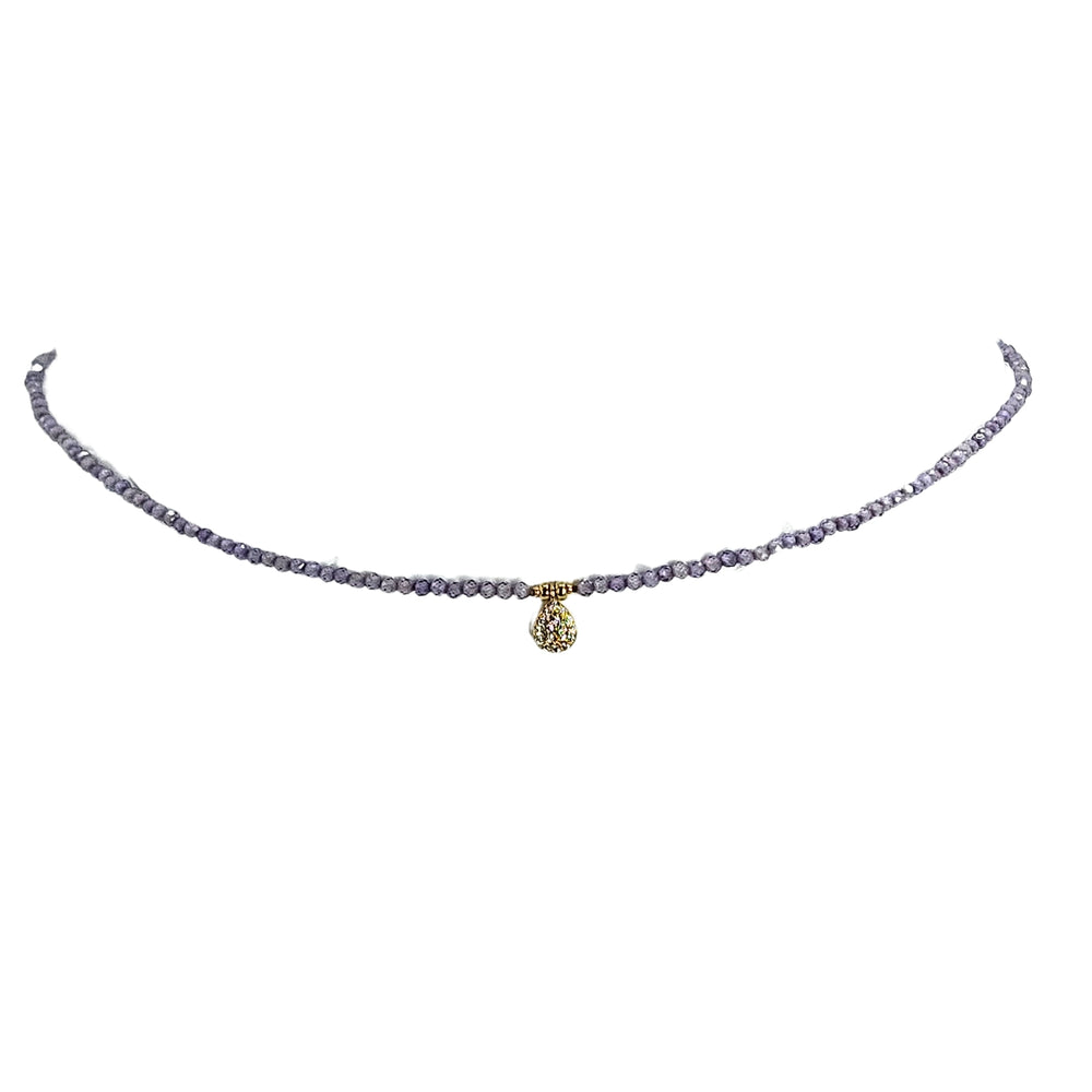 Lavender beaded charm necklace with teardrop faceted pendant and gold-tone clasp