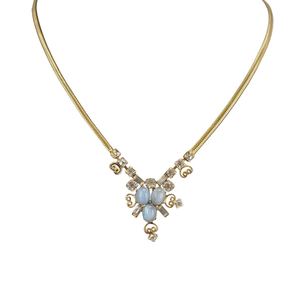 Gold-tone chain necklace with blue cabochon rhinestone cluster pendant
