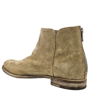 Beige suede ankle boot with side zipper detail and textured outsole