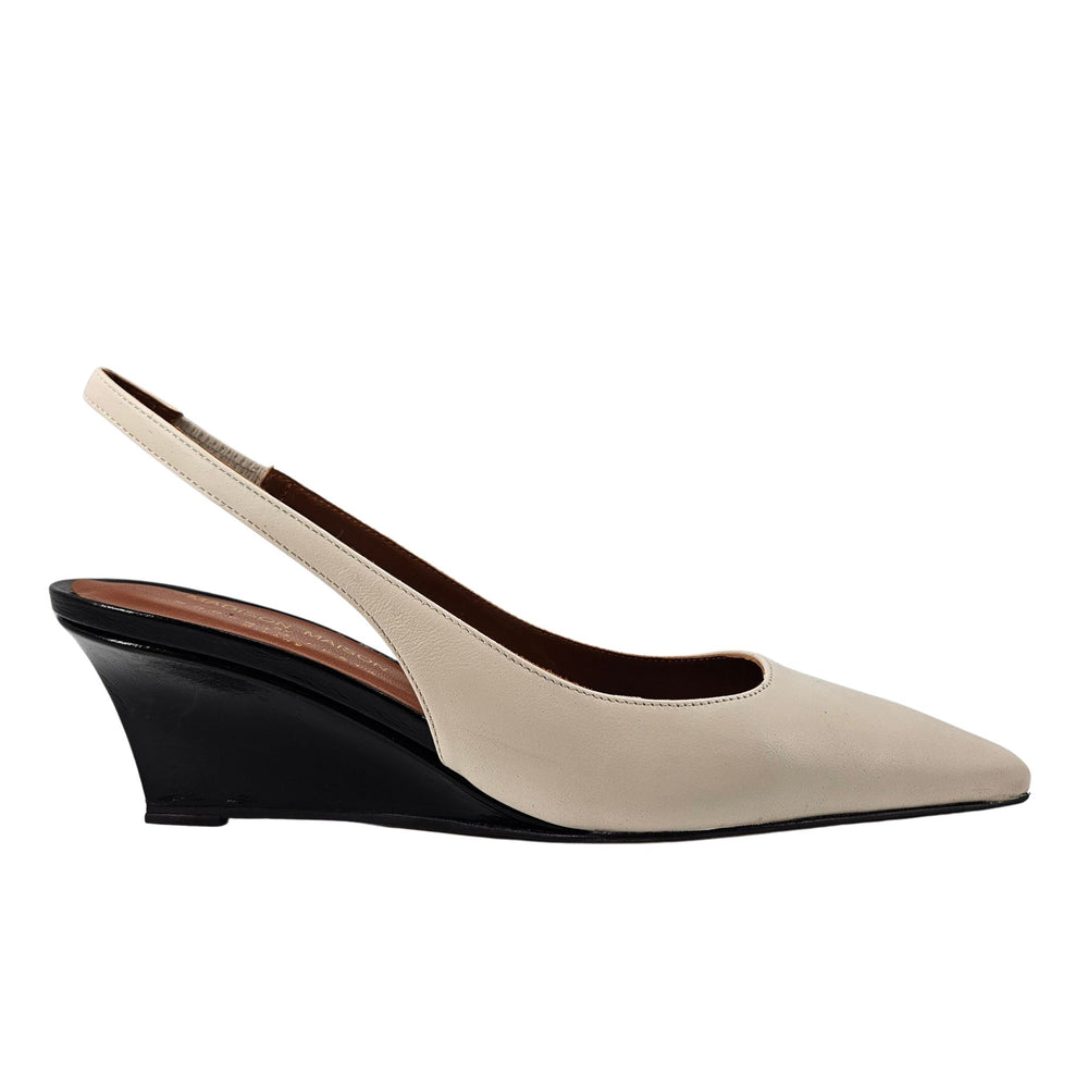 Beige leather slingback wedge heels with pointed toe and black wedge heel