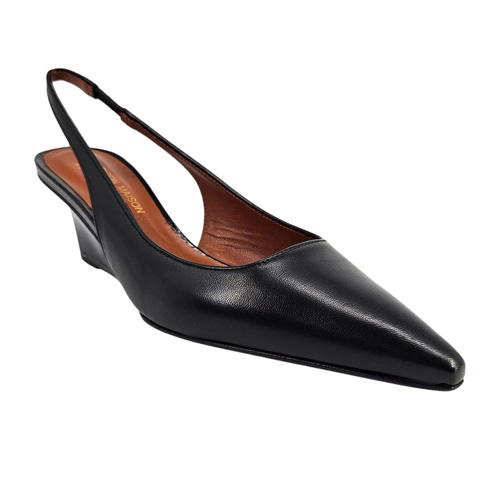 Black leather slingback wedge heel with pointed toe, side view.