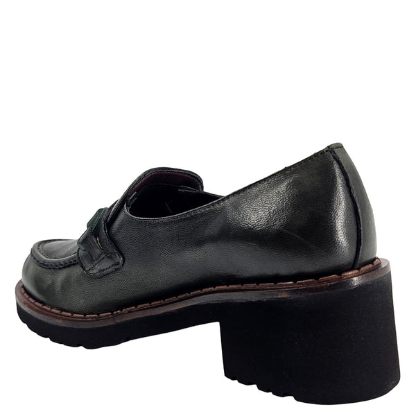 Dark leather loafer with moc strap, thick lug sole, and rounded back profile