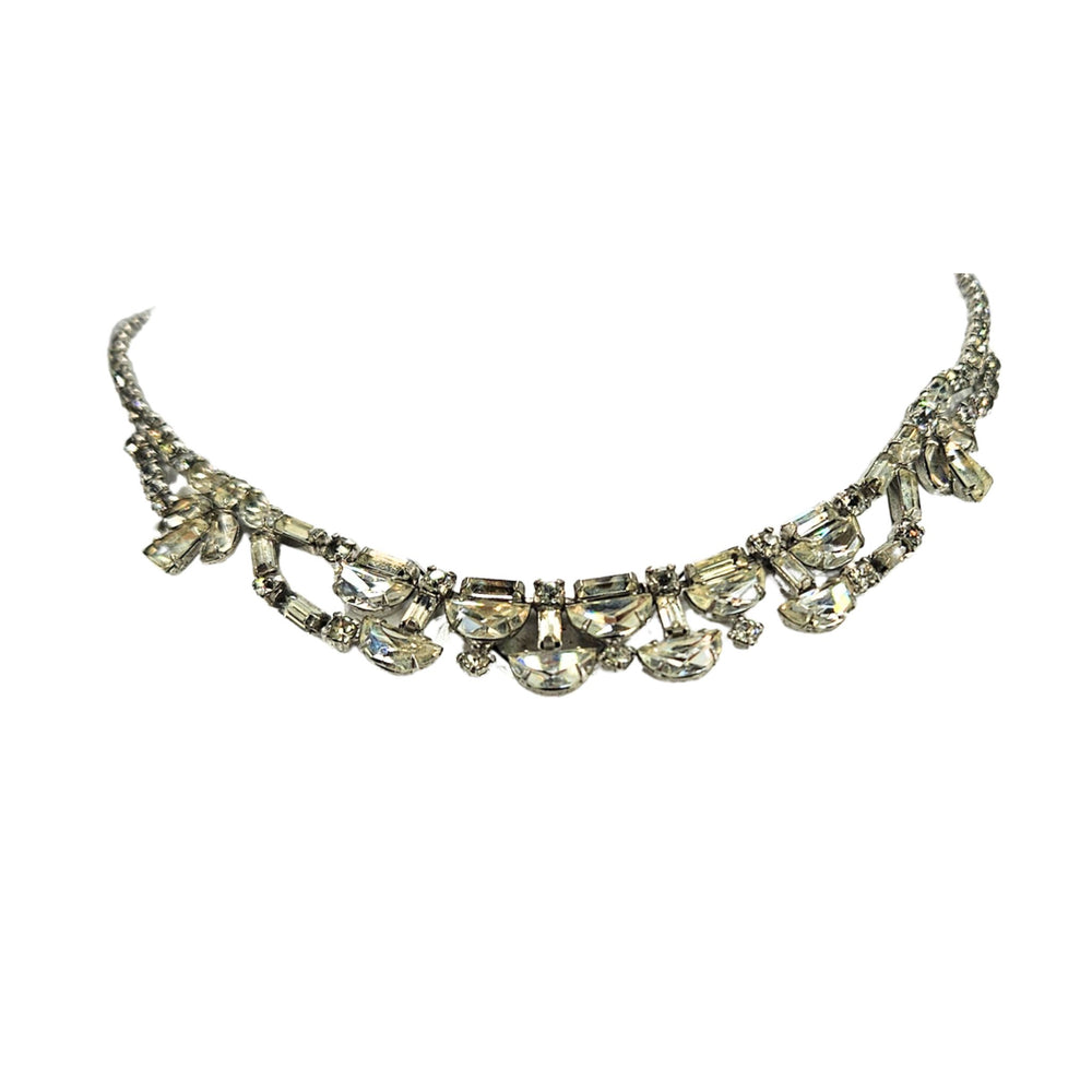 Silver rhinestone necklace with curved rows and bow-like side accents