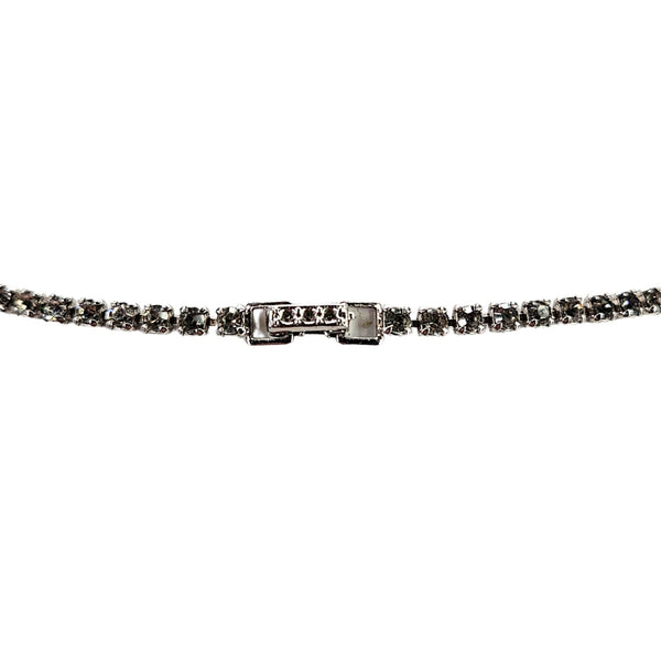 Silver rhinestone necklace clasp detail with rectangular closure and sparkling border
