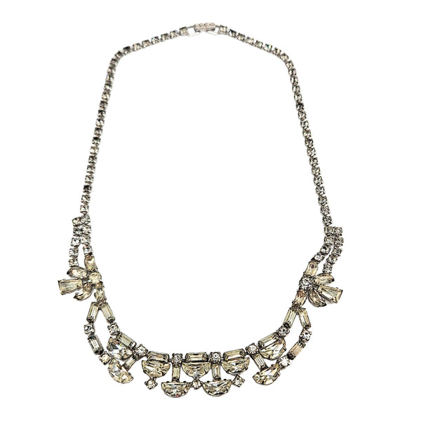 Silver rhinestone necklace with marquise links and bow-and-loop side motifs