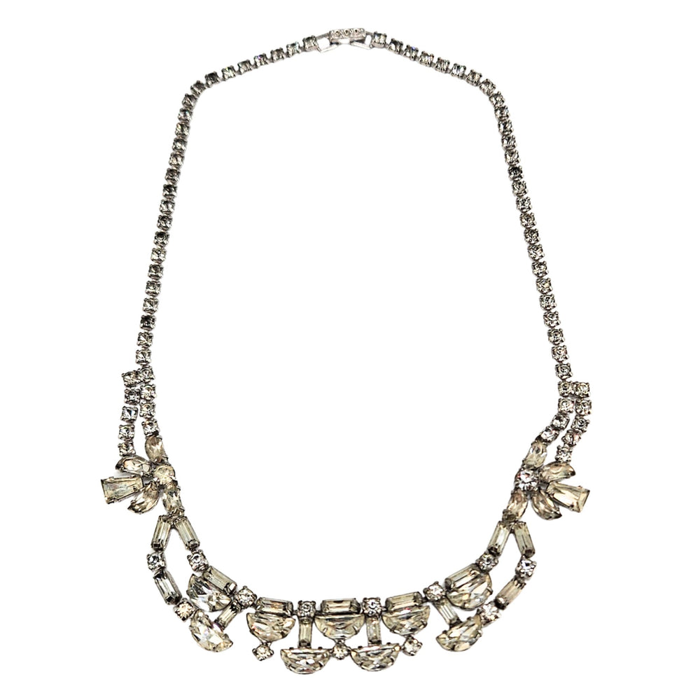 Silver rhinestone necklace with curved rows and bow-like side accents