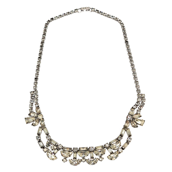 Silver rhinestone necklace with curved rows and bow-like side accents