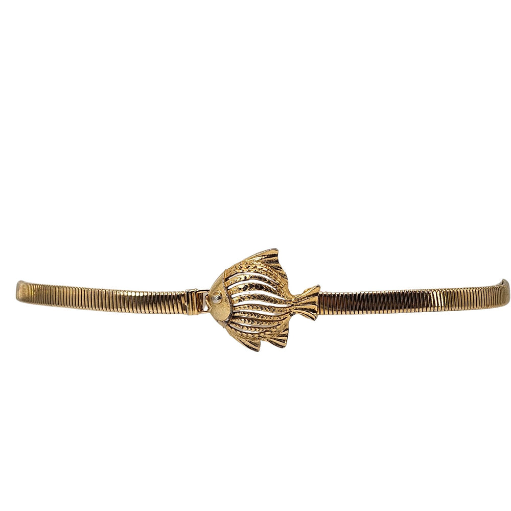 Goldtone stretch belt with round fish charm buckle, vintage-style ridged detail