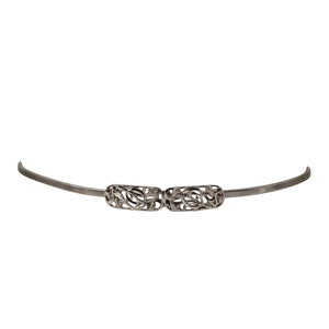 Silver stretch belt with linked filigree buckle center and adjustable end tabs
