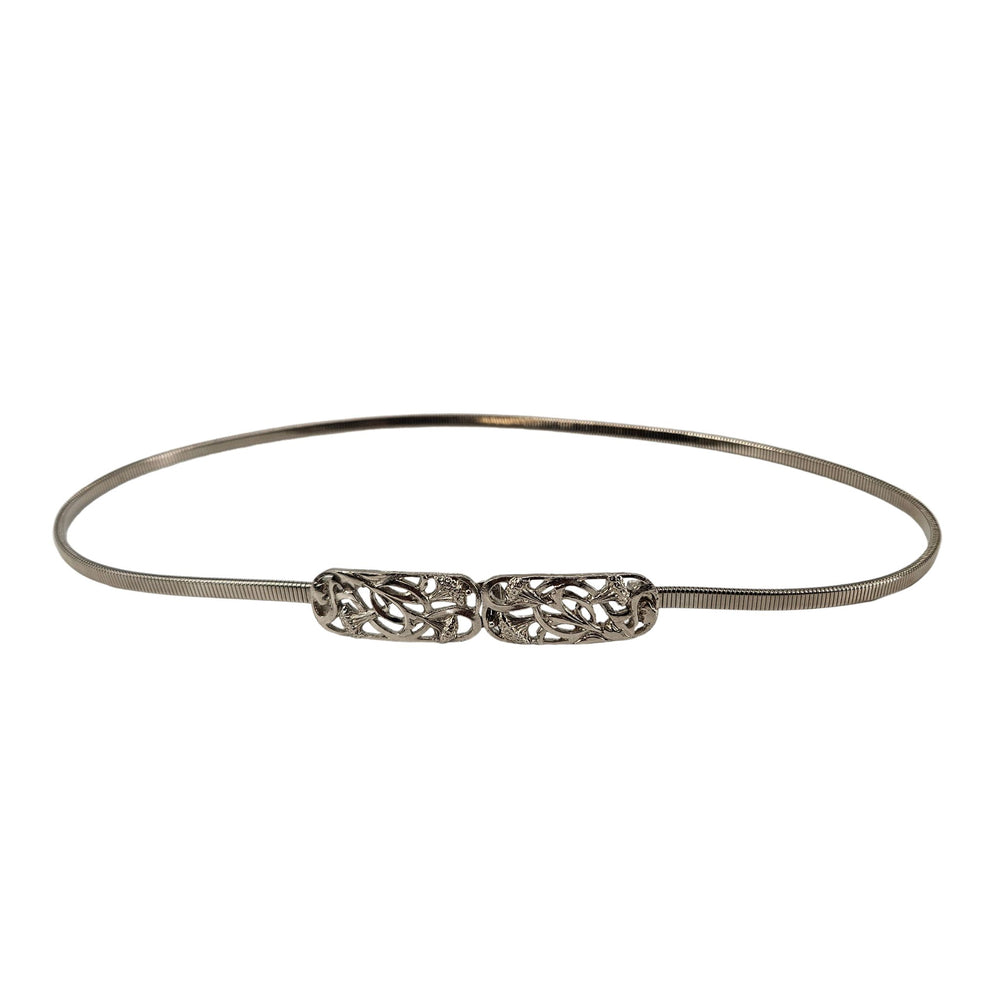 Silver stretch belt with ornate floral filigree buckle center